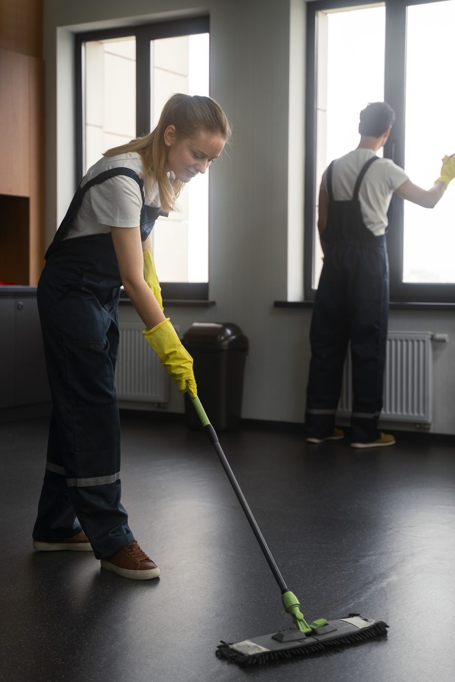 Truly, Truly Clean crew mopping floors and cleaning windows in a commercial space